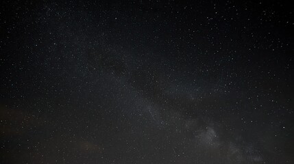 The pitch-black night sky, with the visible Milky Way at its center, presents an eerie and mysterious atmosphere, perfect for space-travel or cosmic-event imagining.