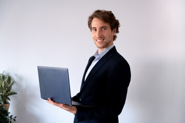 Confident entrepreneur working on his laptop. Professional and motivational imagery