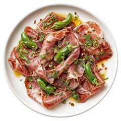 Sliced raw ham with green chili peppers and fresh herbs