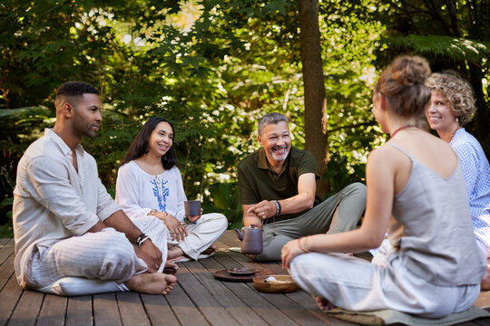 Healthy people group relaxing together during a detox retreat