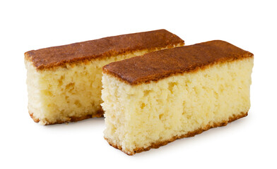 Two pieces of sponge cake close-up on a white. Isolated