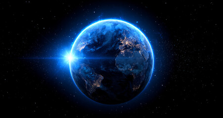 Obraz premium Blue Earth glows radiantly, celestial gem in dark space, inspiring awe