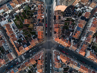 Top down aerial view of houses, gardens, streets and crossroad shaped like a plane in Brussels,...