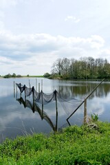 Fishing nets on poles for catching eel and other fish here in the province of Friesland in the North of the Netherlands