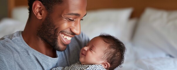 Tender moment of a father holding his newborn baby with love and joy