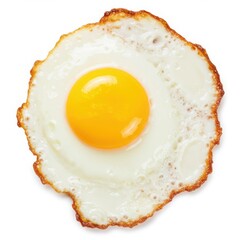 Close up of a fried egg with a bright yellow yolk on a white background plain
