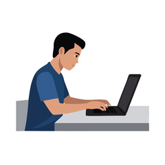 Young man working on laptop computer at desk