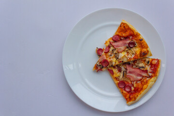 Pizza on a plate, food, fast food, piece of pizza, 2 pieces of pizza on a white plate