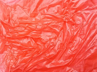 Fototapeta premium Abstrak crumpled red plastic bag texture background