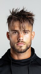 Fototapeta premium A man with a shaved head and a beard