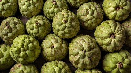 Fototapeta premium Cherimoya Custard apples sold in Mumbai, India, Asia. Tropical fruits. Top view. 