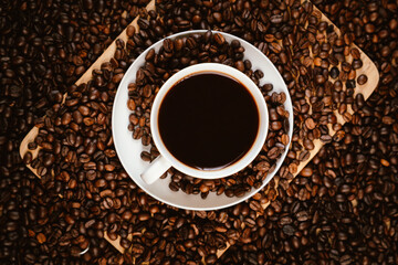 Naklejka premium Close-up of roasted brown coffee beans falling against white background, showcasing texture, aroma, freshness, and energy for a morning brew.