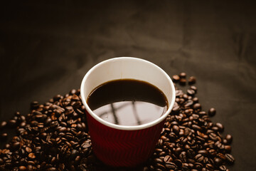 Close-up of roasted brown coffee beans falling against white background, showcasing texture, aroma, freshness, and energy for a morning brew.