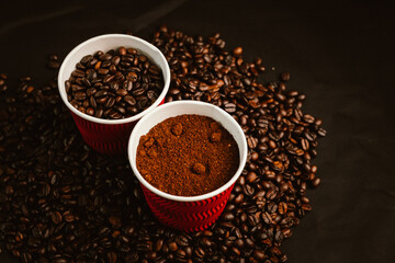 Close-up of roasted brown coffee beans falling against white background, showcasing texture, aroma,...