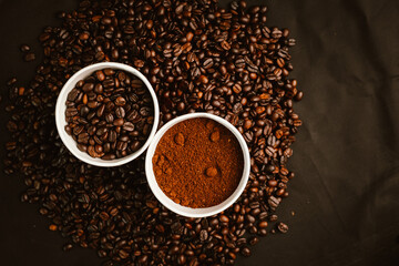 Close-up of roasted brown coffee beans falling against white background, showcasing texture, aroma, freshness, and energy for a morning brew.