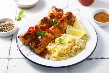 Chicken skewers with couscous and lime