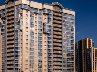 Fototapeta premium A new high-rise apartment building in close-up.