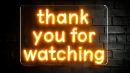 Thank you for watching glowing yellow neon sign on black brick wall as video end screen
