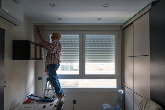 Elderly man engaged in DIY home improvement