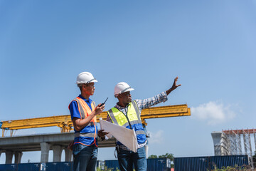 Engineers Discussing Project Progress at Construction Site, Civil Engineers in Safety Gear at Industrial Building Site, Construction Workers Planning Infrastructure Development