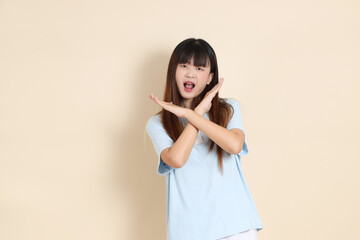 20s Asian Woman in Light Blue Shirt and White Shorts