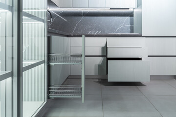 luxurious modern built-in kitchen, lots of built-in upper and lower cabinets, drawers. Grey granite...