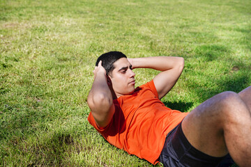 Young man exercising outdoors in a park setting