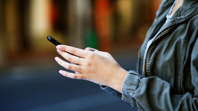 Hands, woman and typing with phone outdoor for direction search, online navigation and location app. Connection, person and smartphone in city for social networking, internet map and communication