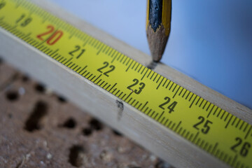 Measuring and marking wood for closet shelves construction