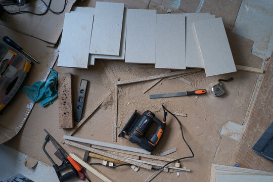 Building closet shelves with tools and materials