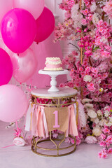 Pink decor with flowers for first birthday