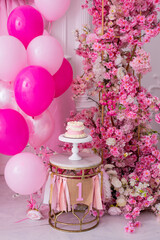 Pink decor with flowers for first birthday
