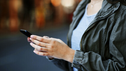 Hands, woman and scroll with phone in city for direction search, online navigation and location...