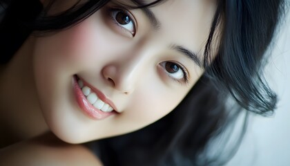 Close-up portrait of a young woman with a beautiful smile.