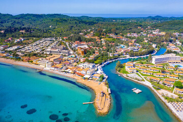Messonghi Beach holiday resort over canal separating Moraitika and Messonghi villages on a Corfu Island, Greece