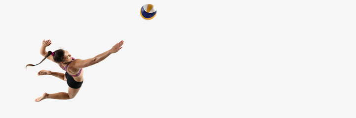 Banner. Aerial view of athletic woman airborne preparing volleyball attack against white studio background with negative space. Concept of power, skill, coordination, sport performance, championship