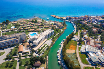 Messonghi Beach holiday resort over canal separating Moraitika and Messonghi villages on a Corfu Island, Greece