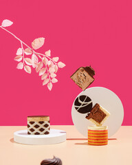 Artistic Dessert Display Featuring Colorful Cakes Accented with Beautiful Leaves