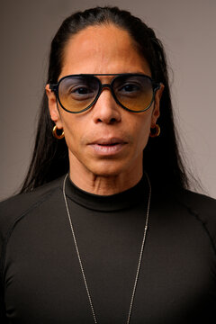 Portrait of a latin man wearing glasses and black shirt