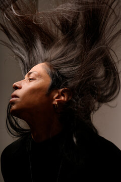Portrait of a man with flowing hair in motion