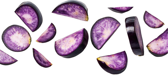 Sliced vibrant purple root vegetables scattered on black background