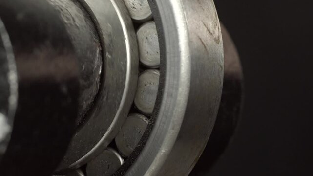 Bearing in cutting press descends and rises close-up.