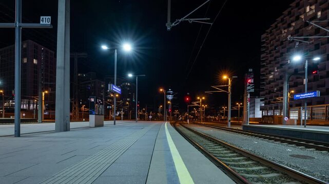 Time lapse clip of trains arriving and departing the main station in Vienna, Austria at night