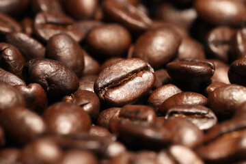 Coffee texture of fresh roasted beans close up. Food photo for backdrops or recipes.