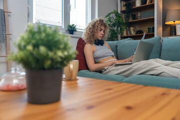 Young woman freelance worker small startup company business owner calculating tax return with data...