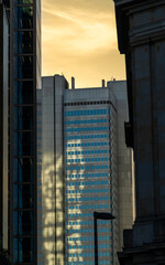 Fototapeta premium Urban cityscape at sunset with modern architecture and skyline