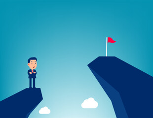 Future. Man on a mountain peak looking at the flag on another peak