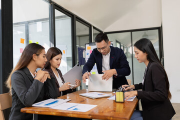 Group of business people working together with dashboard analysis and data management a meeting...
