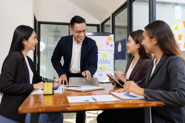Group of business people working together with dashboard analysis and data management a meeting table in office.