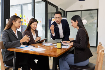 Group of business people working together with dashboard analysis and data management a meeting...